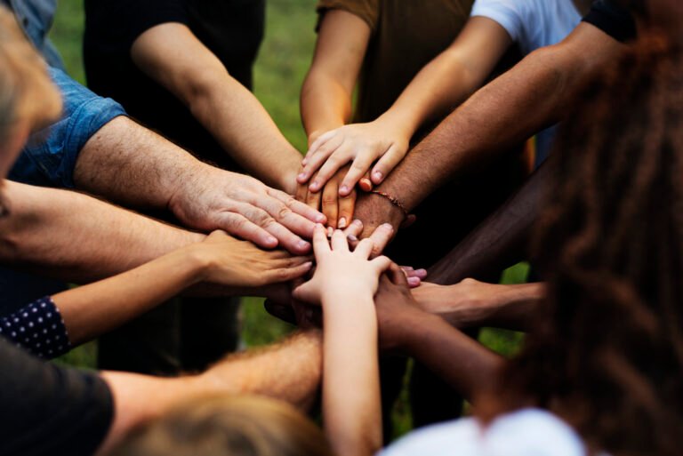 Group of people with their hands together
