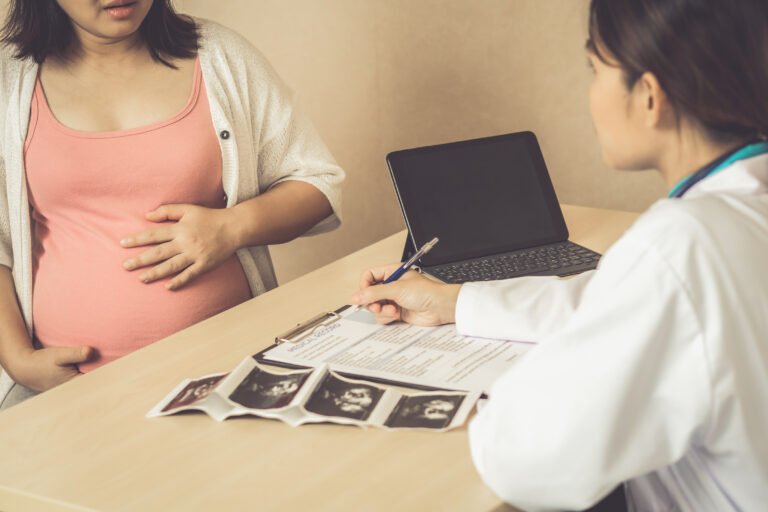 Pregnant Woman and Gynecologist Doctor at Hospital